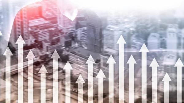 Up arrow graph on skyscraper background. Invesment and financial growth concept