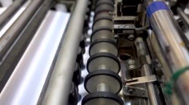 RUSSIA, MOSCOW - OCTOBER 29, 2019. Folding Machine Belts Feed Wheels Metal Industrial Appliance Paper. Editorial