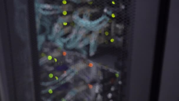 Flashing green lights, blurred server rack. The video contains noise. — Stock Video