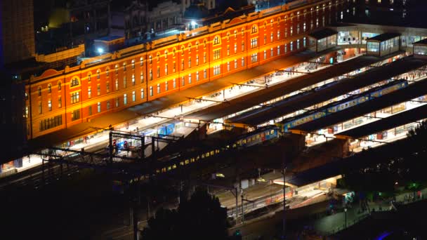 Melbourne City Commute Dusk Passenger Train Arriving Platform Illuminated Lights — Stock Video