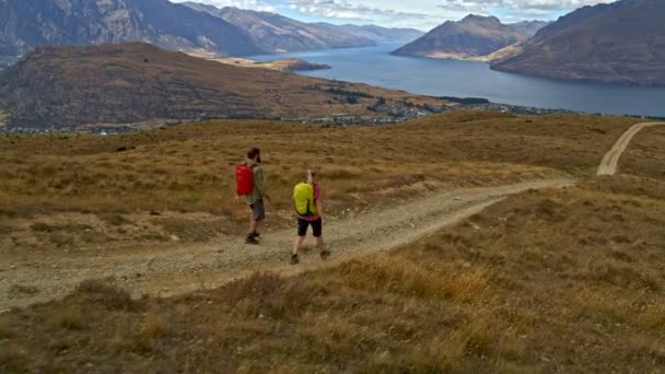 Aerial Drone Active Caucasian Adventure Male Female Hikers Walking Together — Vídeos de Stock