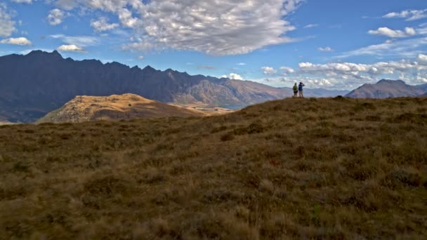 Aerial Drone Healthy Caucasian Male Female Seniors Trekking Using Binoculars — Stock Video