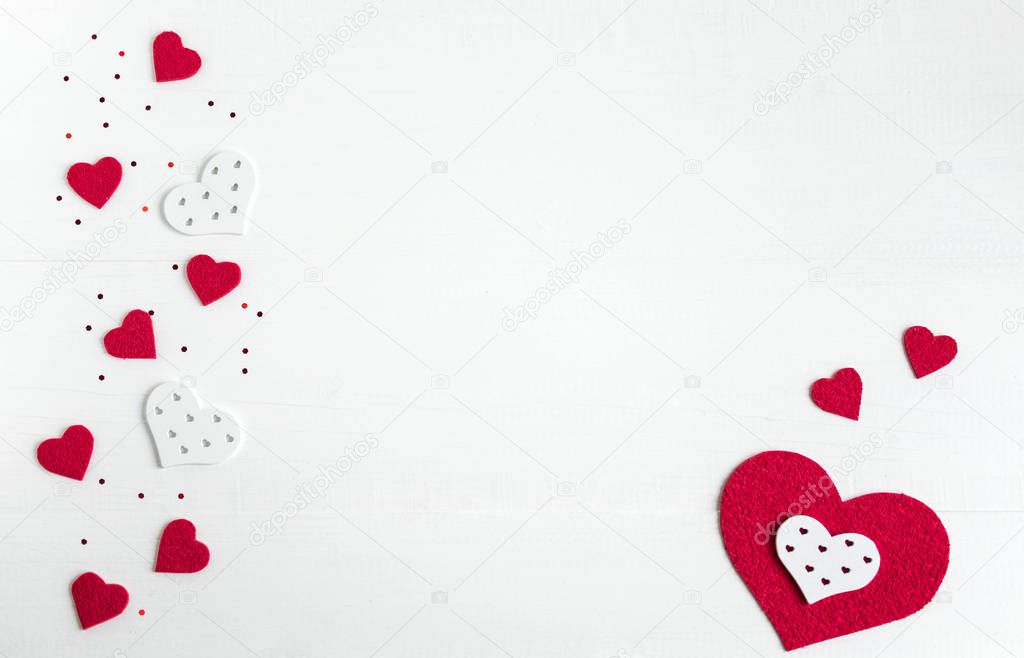 Hearts on a white wooden background. Background for Valentine's Day. Background for a banner with hearts for girls. Card with hearts. Heart shape background.