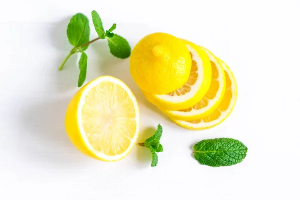 Lemon with mint on a white background. Healthy food products. Vitamin C. Beautiful lemon photo
