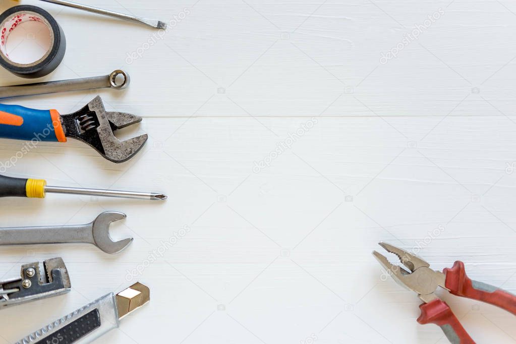 Repair tools on a white background. Banner for a hardware store and a building company. Screwdrivers, pliers, electrical tape.