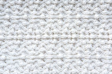 Doku kumaş örme. Figürlü örgü bir ürün için. Dokulu pamuk sıcak örme kumaş.