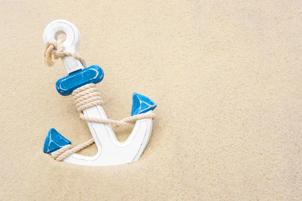 Nautical background with anchor. Anchor in the sand. Frame for a banner text from sand with an anchor