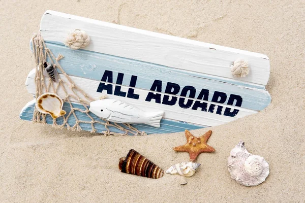 Photoconcept sea travel. Blackboard with the words all aboard, seashells in the sand. Marine photo. Travel, sailor suit — Stock Photo, Image