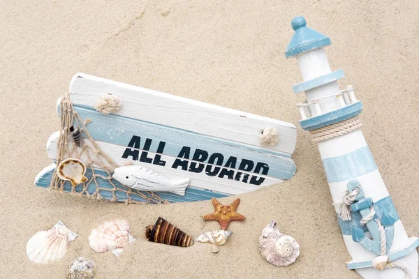 Photoconcept sea travel. Blackboard with the words all aboard, seashells in the sand. Marine photo. Travel, sailor suit — Stock Photo, Image