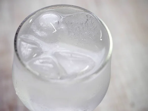 Ice water in a glass cup