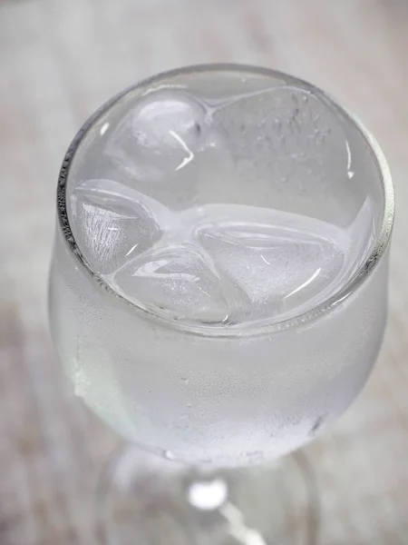 Ice water in a glass cup