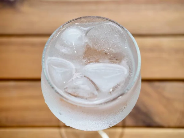 Ice water in a glass cup