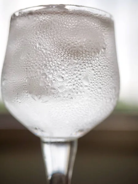 Ice water in a glass cup