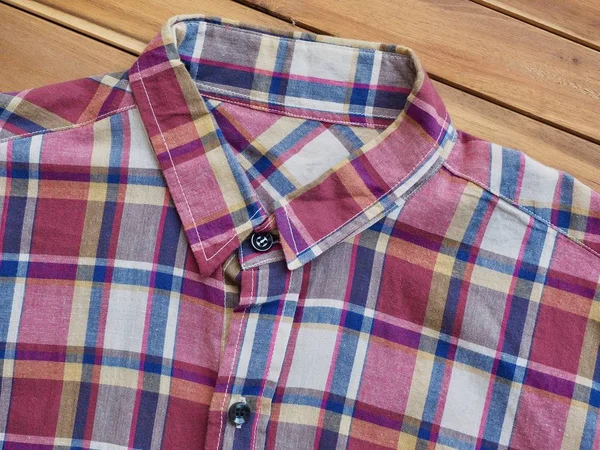 Red, blue, white checkered shirt