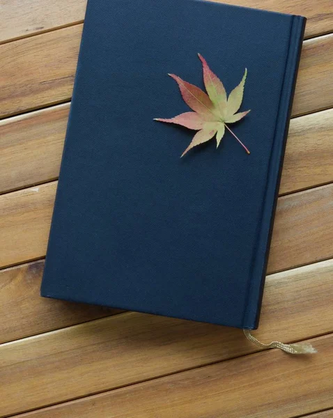 Book and Maple Leaf