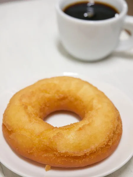 Donuts and coffee ,  sugar powder Donuts