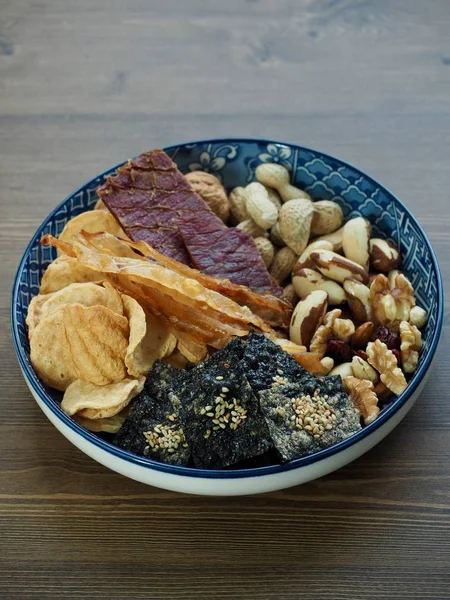 Dried food Beef jerky and  laver cracker and dried filefish and Brazil nuts and Almonds, walnuts, cashew nuts