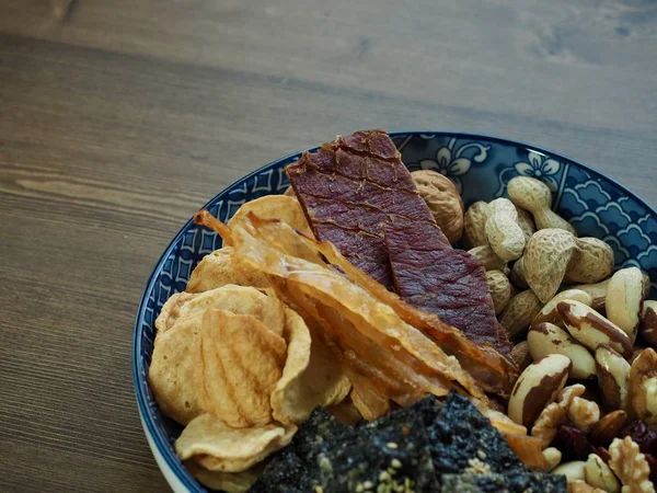 Dried food Beef jerky and  laver cracker and dried filefish and Brazil nuts and Almonds, walnuts, cashew nuts