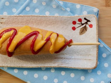 Ketchup and mustard sauce over hot dogs