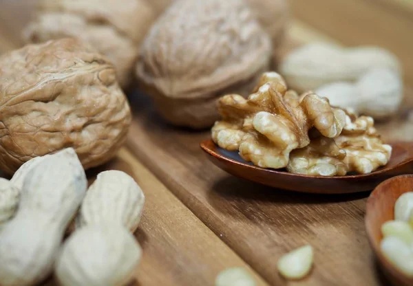 Walnuts and peanuts and pine nuts