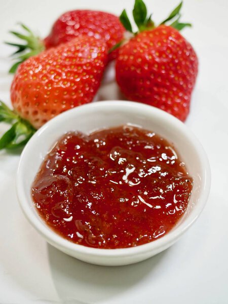 Fresh strawberries and strawberry jam
