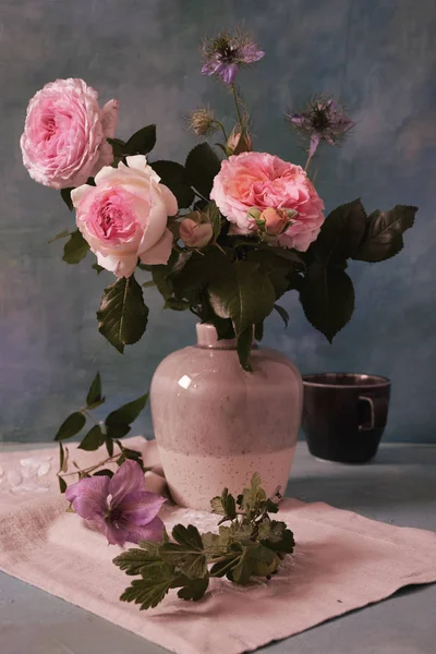 Still life of roses in a vase.