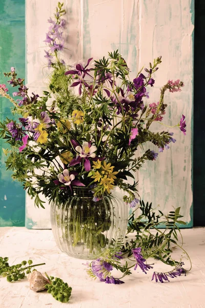 Vase with wildflowers in a glass vase