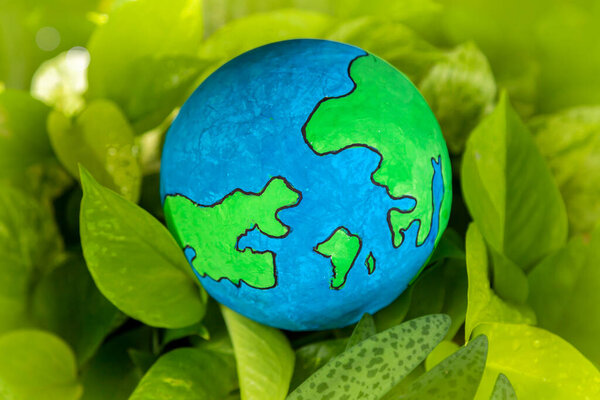 Earth on Green Grass Concept - Earth Day The power of great nature