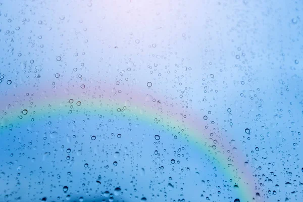 Rain on the window, natural skin of rain, natural patterns of rain water on beautiful sky and rainbow backgrounds