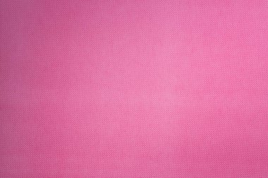 arka plan için küçük beyaz puantiyeli desenli pembe yüzeyinin üstten görünüm