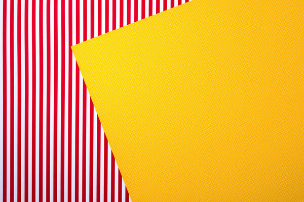 top view of red striped and yellow dotted templates for background