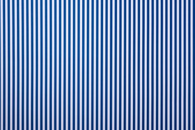 top view of white and blue striped surface for background