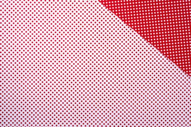 top view of vivid red and white surface with polka dot pattern for background clipart