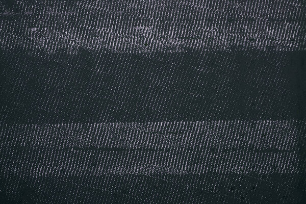 top view of black grinded metal surface for background