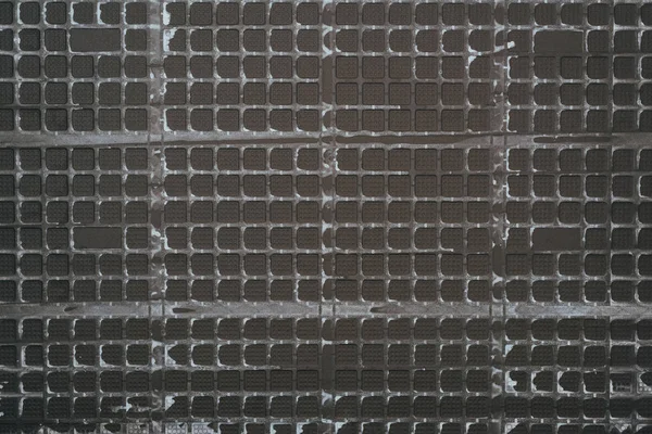 Top View Black Plastic Grid Background — Stock Photo, Image