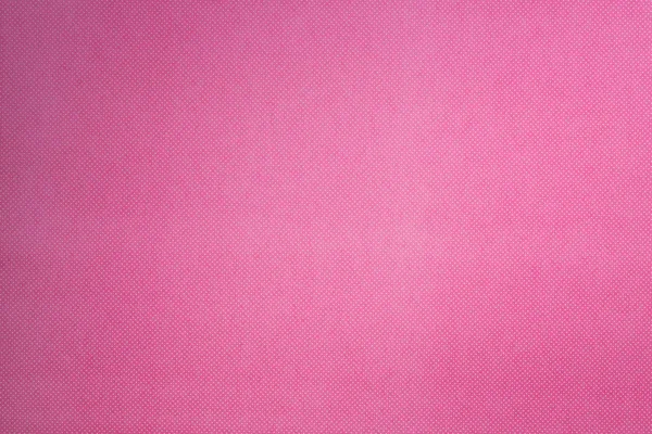 Vista superior da superfície rosa com pequeno padrão de bolinhas brancas para fundo — Fotografia de Stock