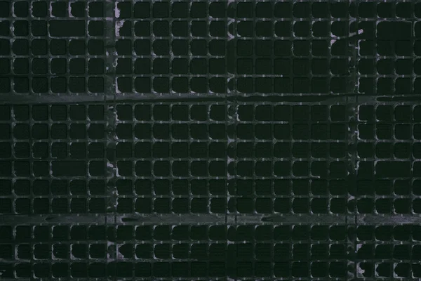 Top view of industrial black plastic grid for background — Stock Photo