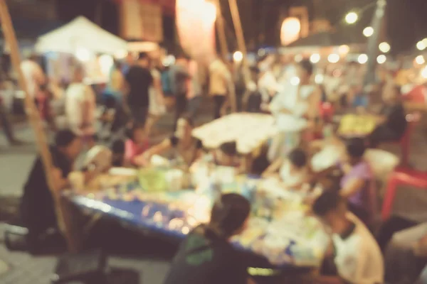 Blur the country river evening market Thai style with people relax and chill out bokeh background.