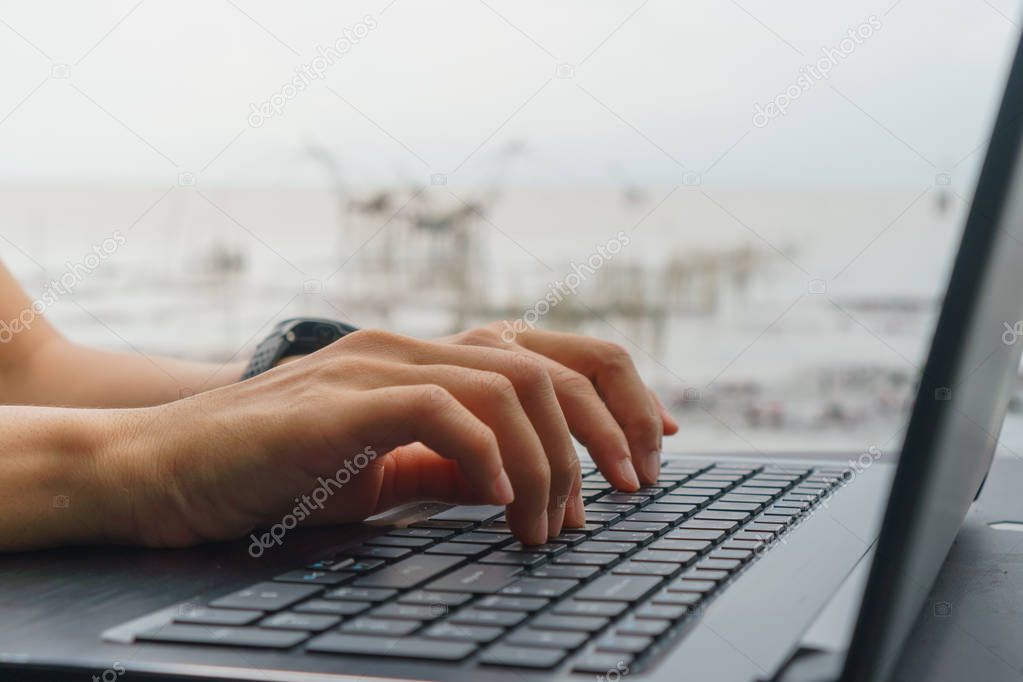 Woman hand using laptop and smartphone to work study on bed in room with nature beautiful background. Business, financial, trade stock maket and social network freedom life concept. 