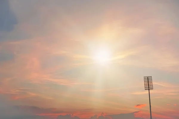 Stadium lighting on twilight colorful sky background.