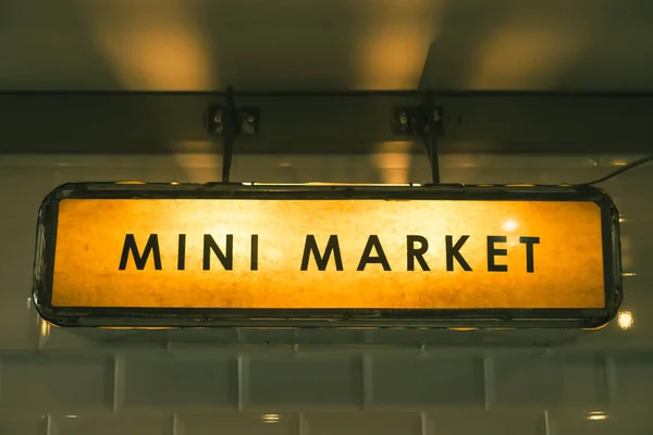 Sign show mini market word hang from ceiling vintage color tone.