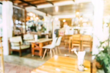Bulanık kahve ve müşterilerin arka plan vintage ton renk tarzına sahip dinlendirici kafe.
