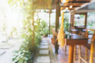 Bulanık kahve ve müşterilerin arka plan vintage ton renk tarzına sahip dinlendirici kafe.