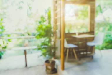 Bulanık kahve ve müşterilerin arka plan vintage ton renk tarzına sahip dinlendirici kafe.