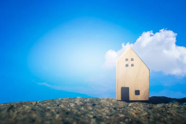 Closed up tiny home models on  with sunlight and blue sky.