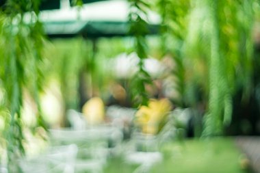 Bulanık kahve ve müşterilerin arka plan vintage ton renk tarzına sahip dinlendirici kafe.