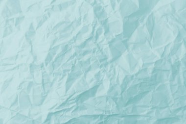 Mavi buruşmuş kağıt dokusu arkaplanının üst görünümü.