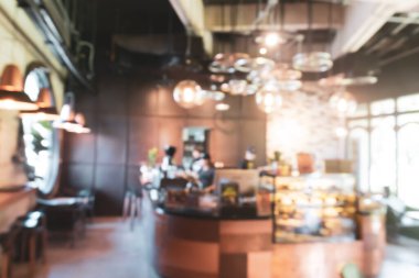 Bulanık kahve ve müşterilerin arka plan vintage ton renk tarzına sahip dinlendirici kafe.