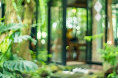 Bulanık kahve ve müşterilerin arka plan vintage ton renk tarzına sahip dinlendirici kafe.