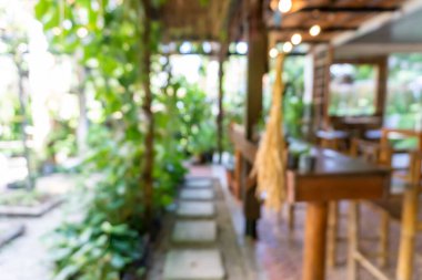 Bulanık kahve ve müşterilerin arka plan vintage ton renk tarzına sahip dinlendirici kafe.